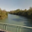 Vue sur la Seine et ses rives boisées depuis un pont